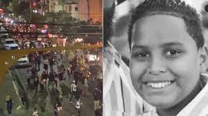 Marchan y encienden velas por muerte de niño a manos de cabo de la Policía en Santiago